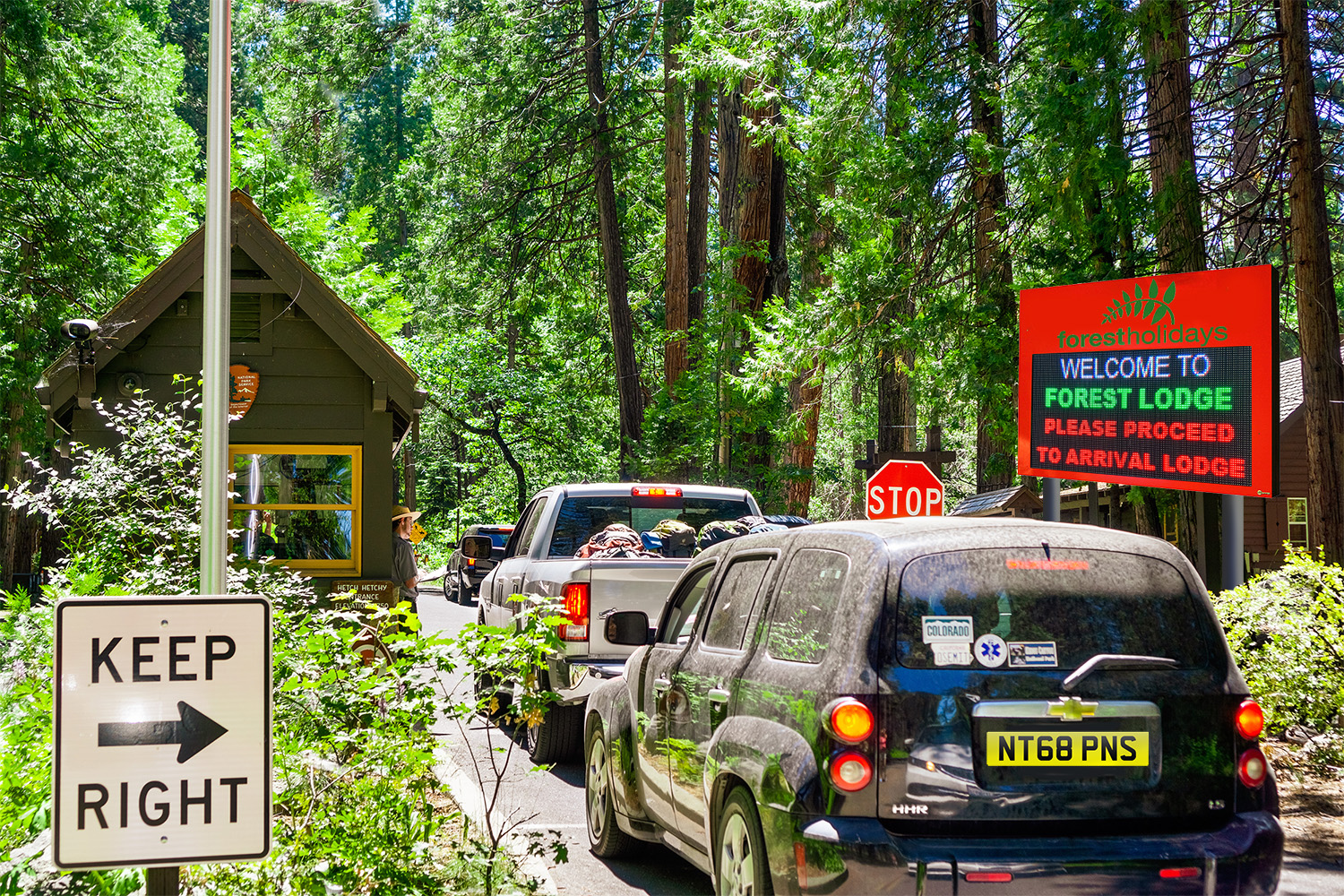 June 26, 2019 Yosemite National Park / CA / USA - Busy entrance June 26, 2019 Yosemite National Park / CA / USA - Busy entrance station to Yosemite National Park, with cars waiting in line to obtain a permit